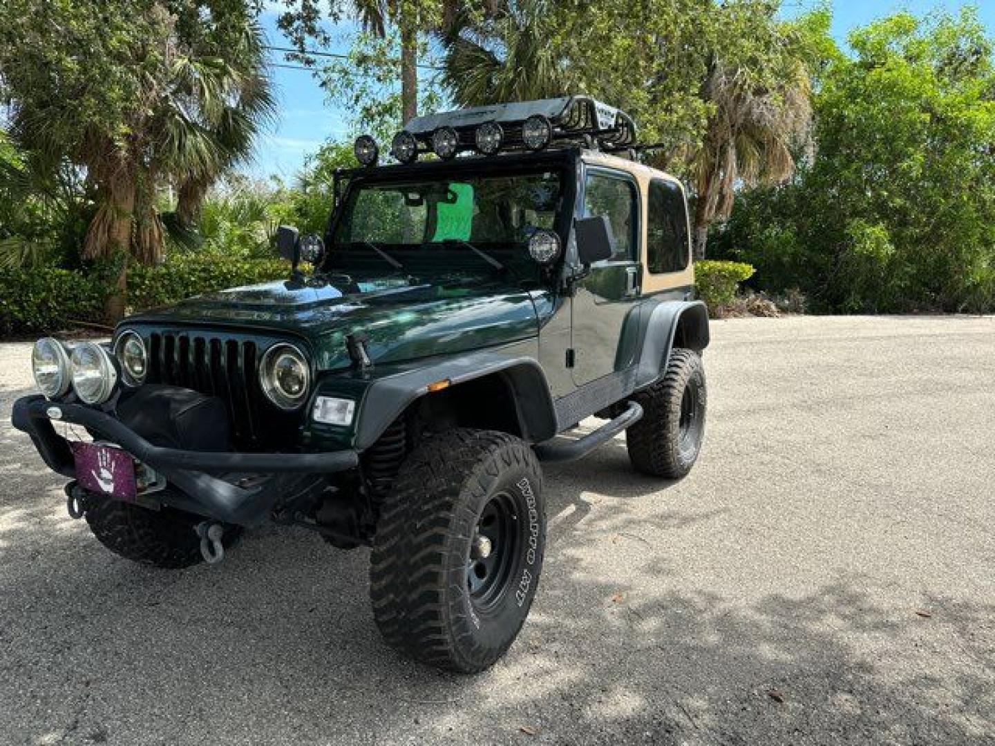 1999 Forest Green Pearlcoat /Agate Vinyl Jeep Wrangler Sport (1J4FY19S5XP) with an 4.0L L6 OHV 12V engine, located at 11100 Summerlin Square Dr., Fort Myers Beach, FL, 33931, (239) 999-7777, 26.493452, -81.938683 - Photo#0