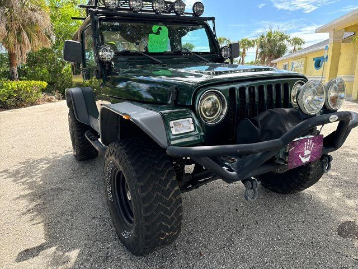 1999 Forest Green Pearlcoat /Agate Vinyl Jeep Wrangler Sport (1J4FY19S5XP) with an 4.0L L6 OHV 12V engine, located at 11100 Summerlin Square Dr., Fort Myers Beach, FL, 33931, (239) 999-7777, 26.493452, -81.938683 - Photo#3