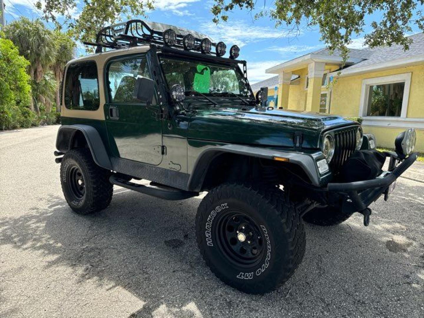 1999 Forest Green Pearlcoat /Agate Vinyl Jeep Wrangler Sport (1J4FY19S5XP) with an 4.0L L6 OHV 12V engine, located at 11100 Summerlin Square Dr., Fort Myers Beach, FL, 33931, (239) 999-7777, 26.493452, -81.938683 - Photo#5