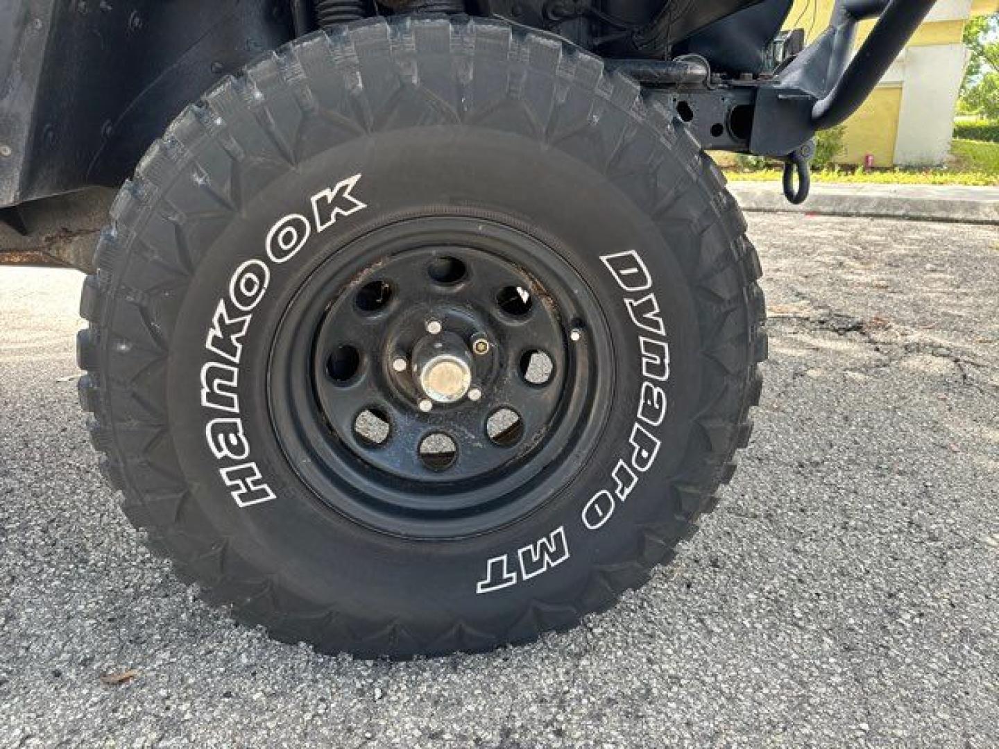 1999 Forest Green Pearlcoat /Agate Vinyl Jeep Wrangler Sport (1J4FY19S5XP) with an 4.0L L6 OHV 12V engine, located at 11100 Summerlin Square Dr., Fort Myers Beach, FL, 33931, (239) 999-7777, 26.493452, -81.938683 - Photo#7