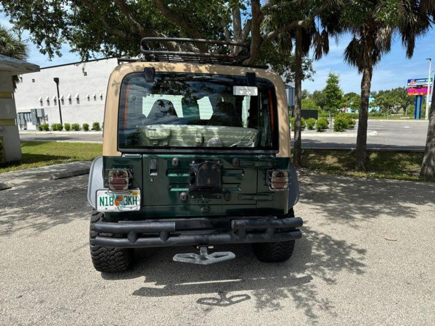 1999 Forest Green Pearlcoat /Agate Vinyl Jeep Wrangler Sport (1J4FY19S5XP) with an 4.0L L6 OHV 12V engine, located at 11100 Summerlin Square Dr., Fort Myers Beach, FL, 33931, (239) 999-7777, 26.493452, -81.938683 - Photo#9