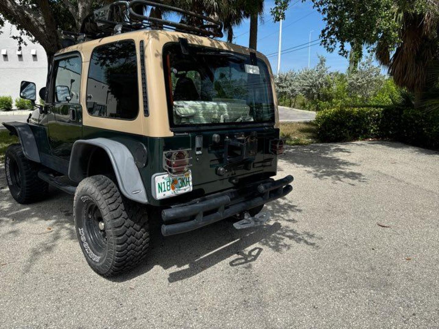 1999 Forest Green Pearlcoat /Agate Vinyl Jeep Wrangler Sport (1J4FY19S5XP) with an 4.0L L6 OHV 12V engine, located at 11100 Summerlin Square Dr., Fort Myers Beach, FL, 33931, (239) 999-7777, 26.493452, -81.938683 - Photo#10