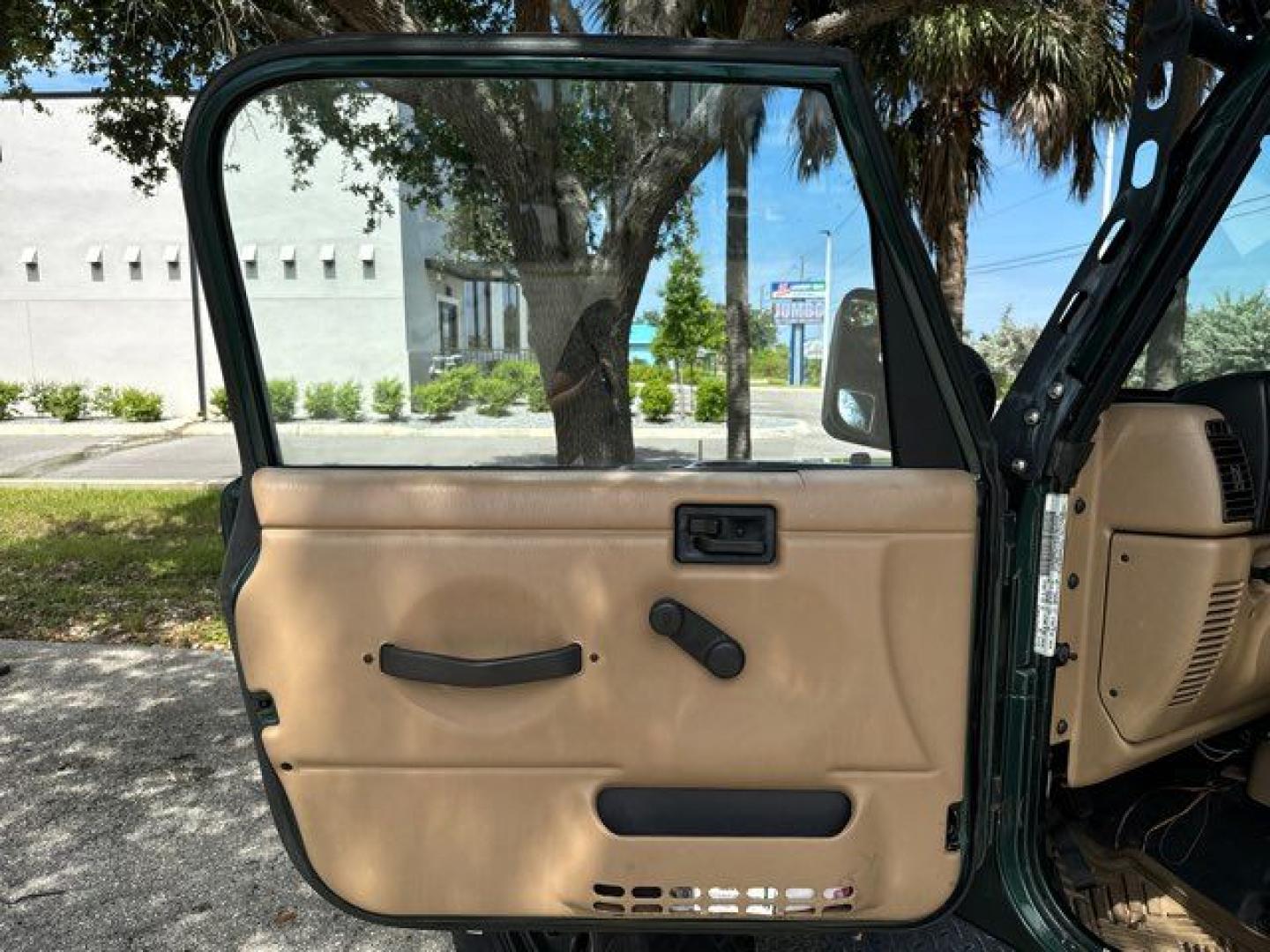 1999 Forest Green Pearlcoat /Agate Vinyl Jeep Wrangler Sport (1J4FY19S5XP) with an 4.0L L6 OHV 12V engine, located at 11100 Summerlin Square Dr., Fort Myers Beach, FL, 33931, (239) 999-7777, 26.493452, -81.938683 - Photo#11