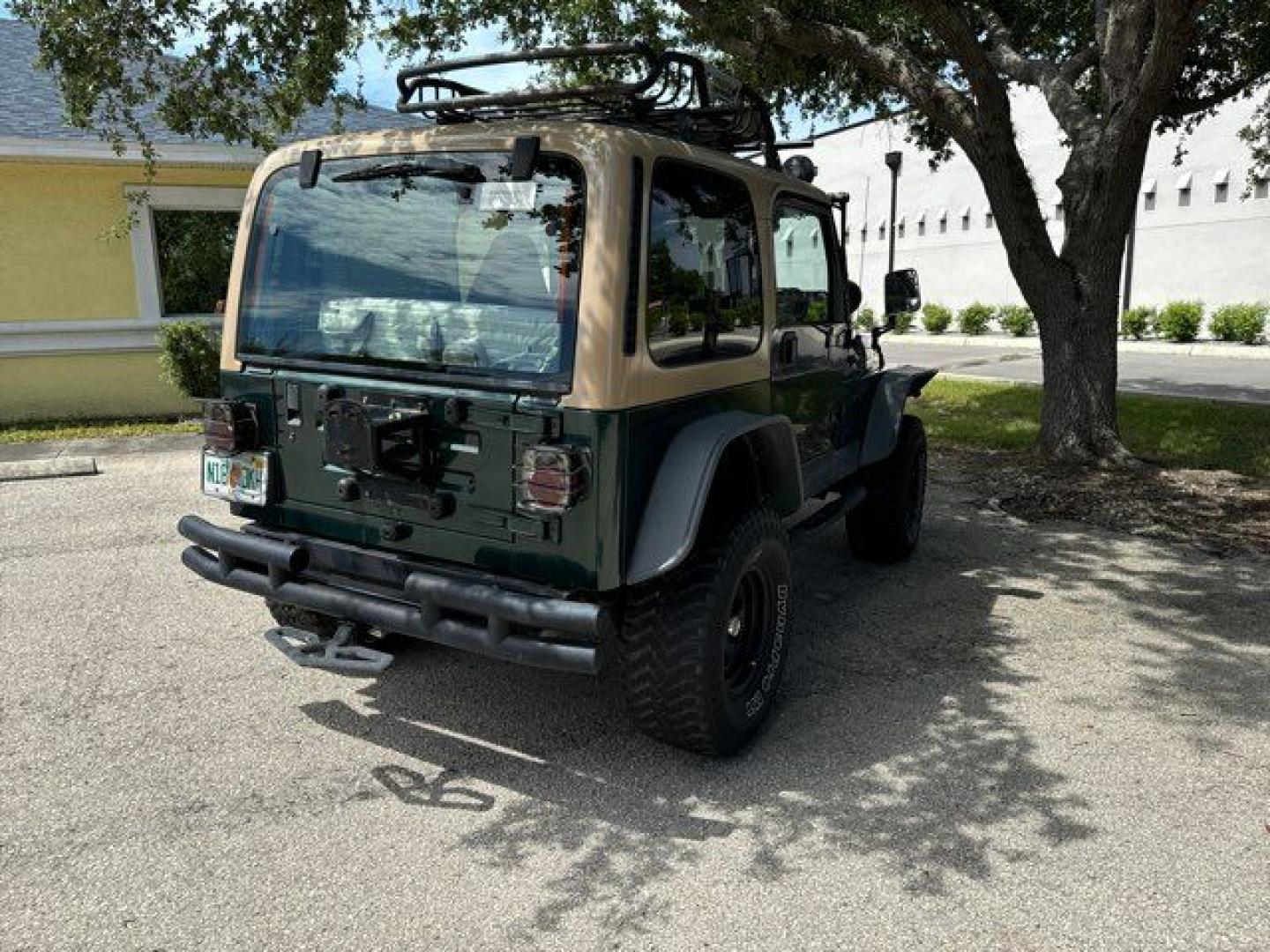 1999 Forest Green Pearlcoat /Agate Vinyl Jeep Wrangler Sport (1J4FY19S5XP) with an 4.0L L6 OHV 12V engine, located at 11100 Summerlin Square Dr., Fort Myers Beach, FL, 33931, (239) 999-7777, 26.493452, -81.938683 - Photo#12