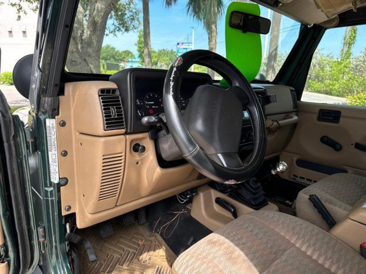 1999 Forest Green Pearlcoat /Agate Vinyl Jeep Wrangler Sport (1J4FY19S5XP) with an 4.0L L6 OHV 12V engine, located at 11100 Summerlin Square Dr., Fort Myers Beach, FL, 33931, (239) 999-7777, 26.493452, -81.938683 - Photo#14