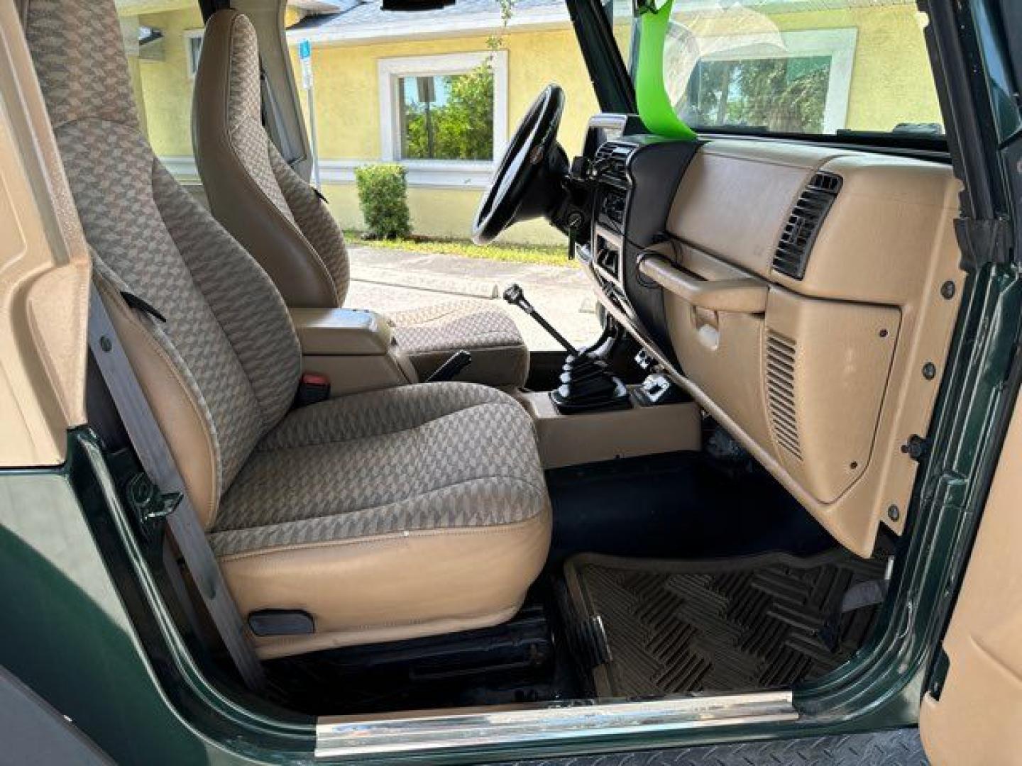 1999 Forest Green Pearlcoat /Agate Vinyl Jeep Wrangler Sport (1J4FY19S5XP) with an 4.0L L6 OHV 12V engine, located at 11100 Summerlin Square Dr., Fort Myers Beach, FL, 33931, (239) 999-7777, 26.493452, -81.938683 - Photo#18