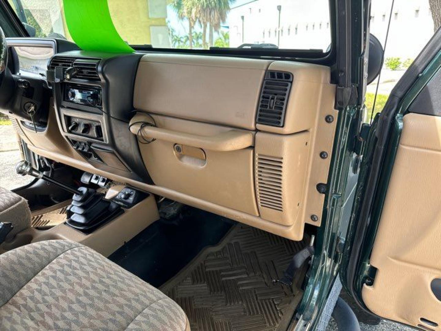 1999 Forest Green Pearlcoat /Agate Vinyl Jeep Wrangler Sport (1J4FY19S5XP) with an 4.0L L6 OHV 12V engine, located at 11100 Summerlin Square Dr., Fort Myers Beach, FL, 33931, (239) 999-7777, 26.493452, -81.938683 - Photo#19