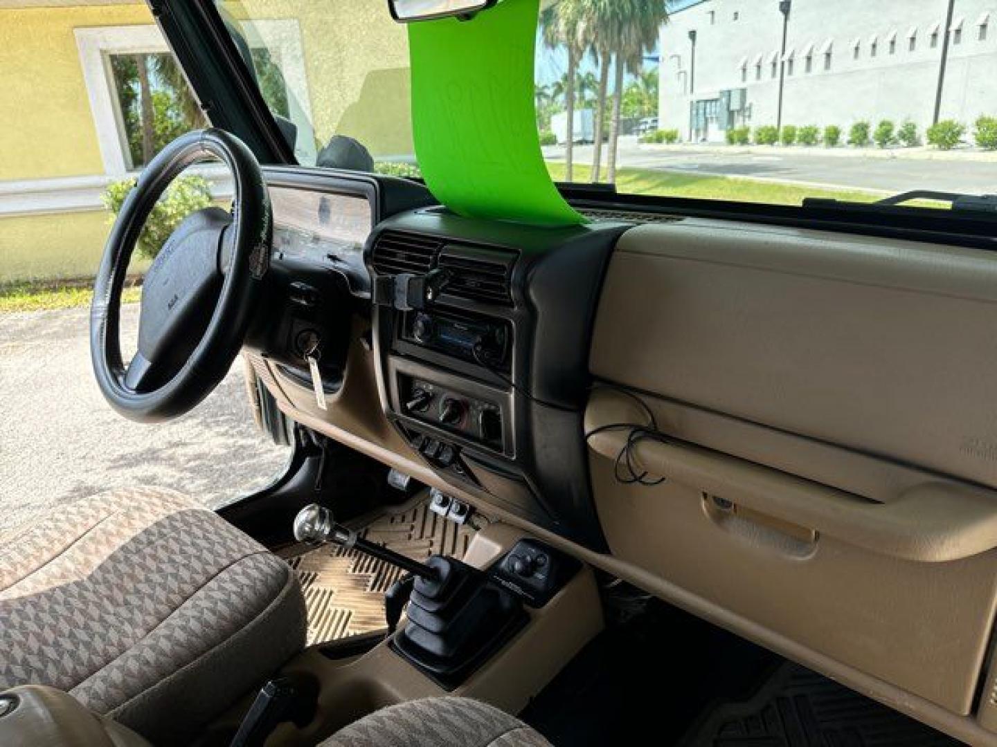 1999 Forest Green Pearlcoat /Agate Vinyl Jeep Wrangler Sport (1J4FY19S5XP) with an 4.0L L6 OHV 12V engine, located at 11100 Summerlin Square Dr., Fort Myers Beach, FL, 33931, (239) 999-7777, 26.493452, -81.938683 - Photo#22