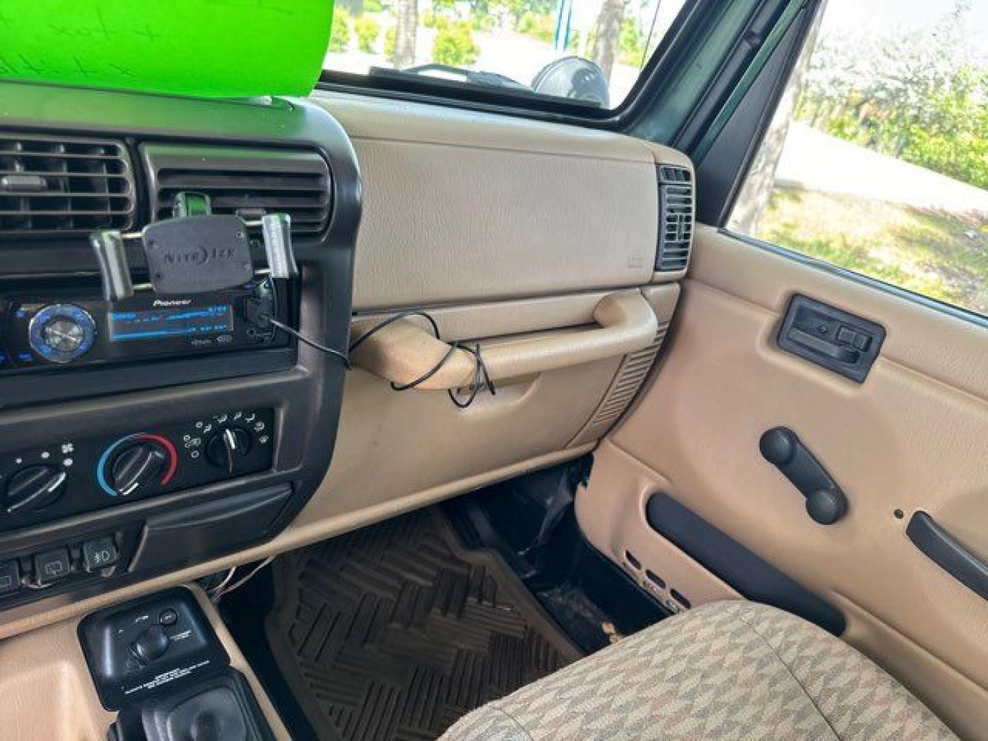 1999 Forest Green Pearlcoat /Agate Vinyl Jeep Wrangler Sport (1J4FY19S5XP) with an 4.0L L6 OHV 12V engine, located at 11100 Summerlin Square Dr., Fort Myers Beach, FL, 33931, (239) 999-7777, 26.493452, -81.938683 - Photo#24